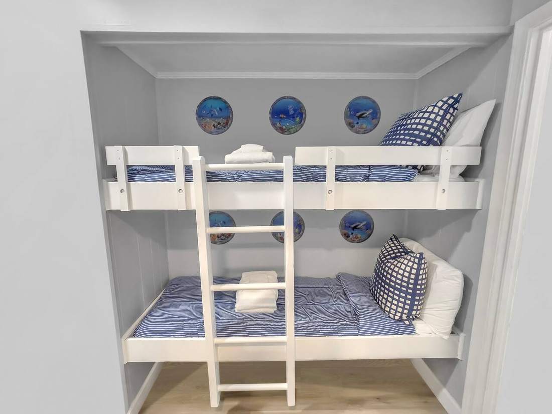 Built-in kids bunk beds with porthole details