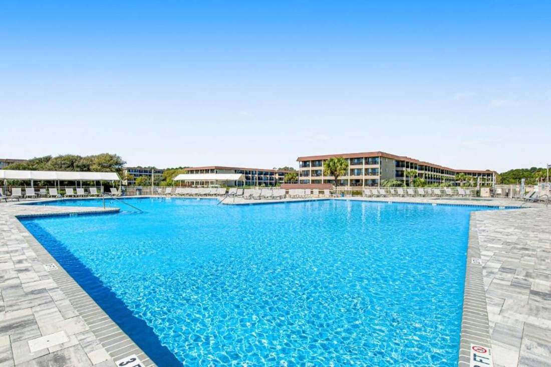Sparkling resort pool with loungers